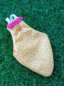 A yellow Cheongsam flight suit with pink oriental knot for a baby Caique parrot, Zaza!